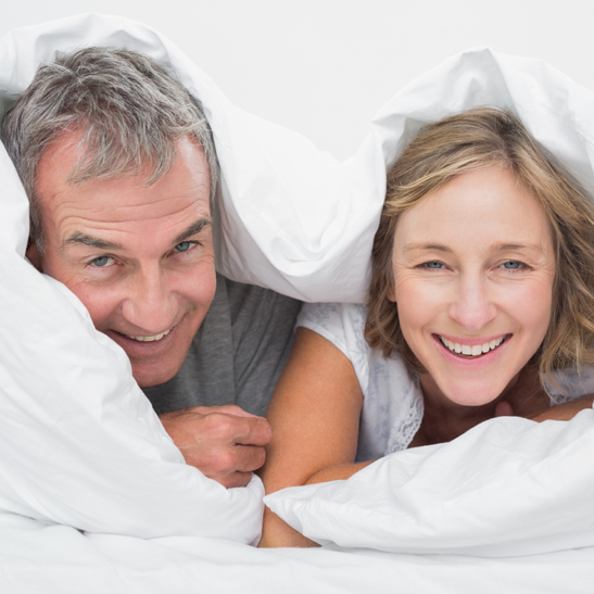 couple under a duvet - CPAP.co.uk